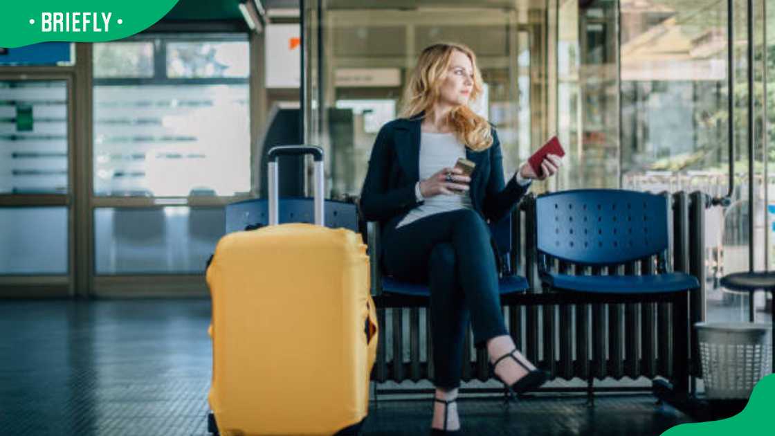A woman waiting for her flight A woman waiting for her flight