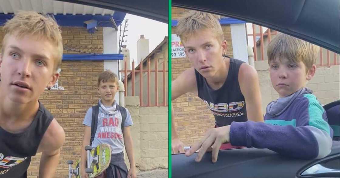 A man gave out cash to three boys in a Facebook video. A man gave out cash to three boys in a Facebook video.