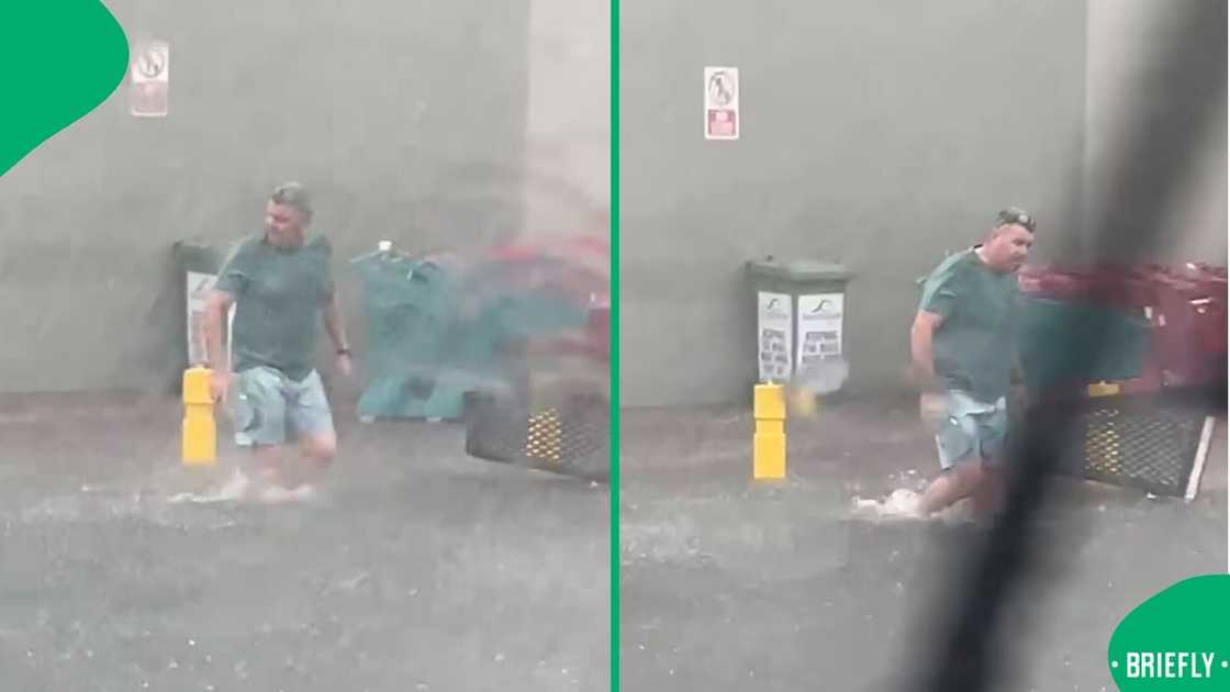 A man walked through the KwaZulu-Natal flooding at a shopping centre. A man walked through the KwaZulu-Natal flooding at a shopping centre.