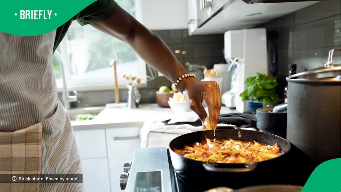The woman has several videos of herself cooking in the kitchen. The woman has several videos of herself cooking in the kitchen.