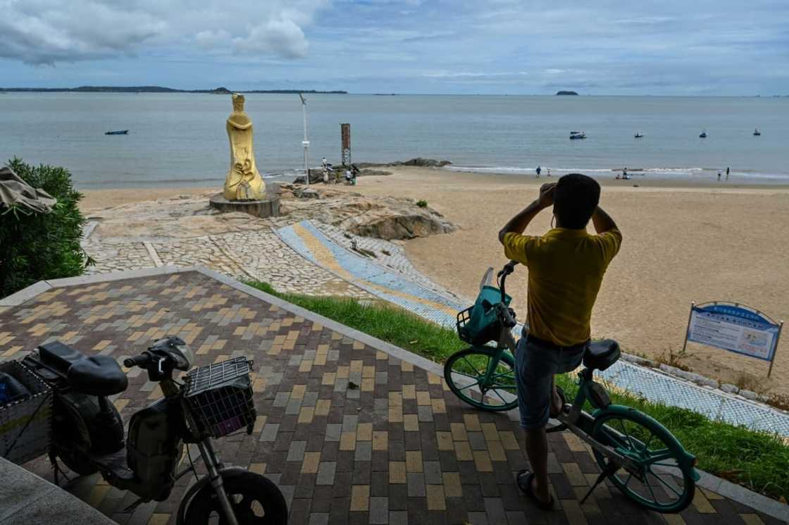 Beachgoers in the Chinese city of Xiamen, just a few kilometres from a Taiwan-controlled island, told AFP they had little fear over the potential for war Beachgoers in the Chinese city of Xiamen, just a few kilometres from a Taiwan-controlled island, told AFP they had little fear over the potential for war