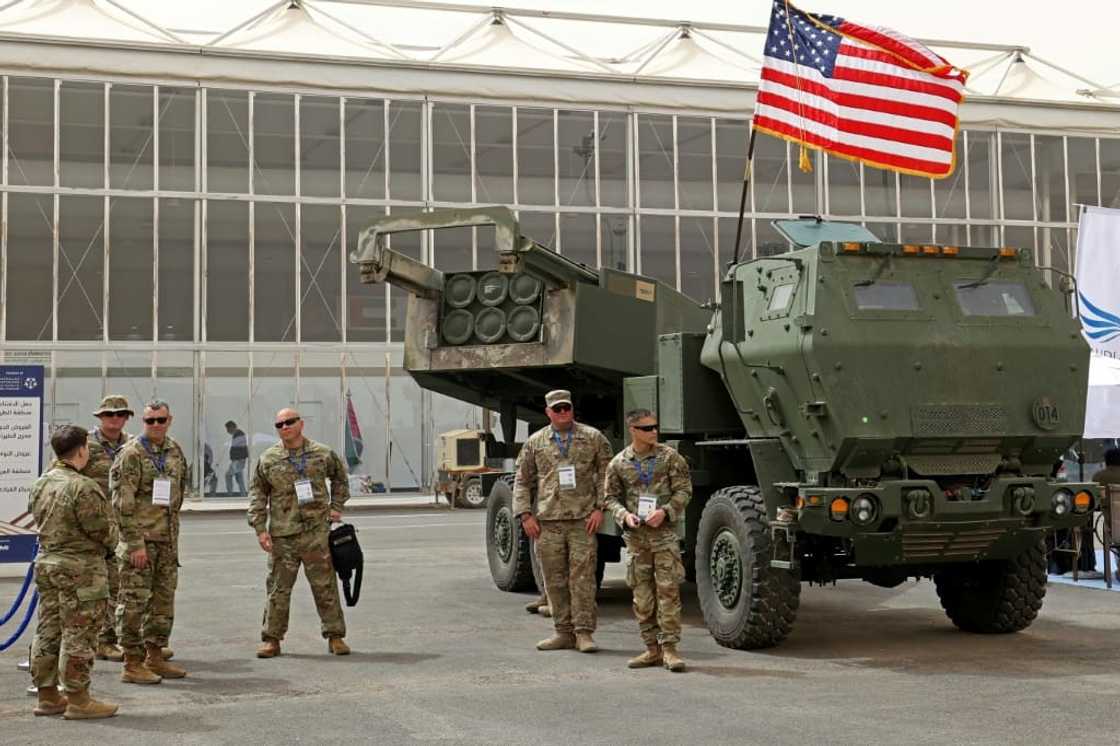 US military personnel in Saudi Arabia stand in March 2022 by a M142 High Mobility Artillery Rocket System (Himars)-- which has been put to use by Ukraine against Russian invaders US military personnel in Saudi Arabia stand in March 2022 by a M142 High Mobility Artillery Rocket System (Himars)-- which has been put to use by Ukraine against Russian invaders
