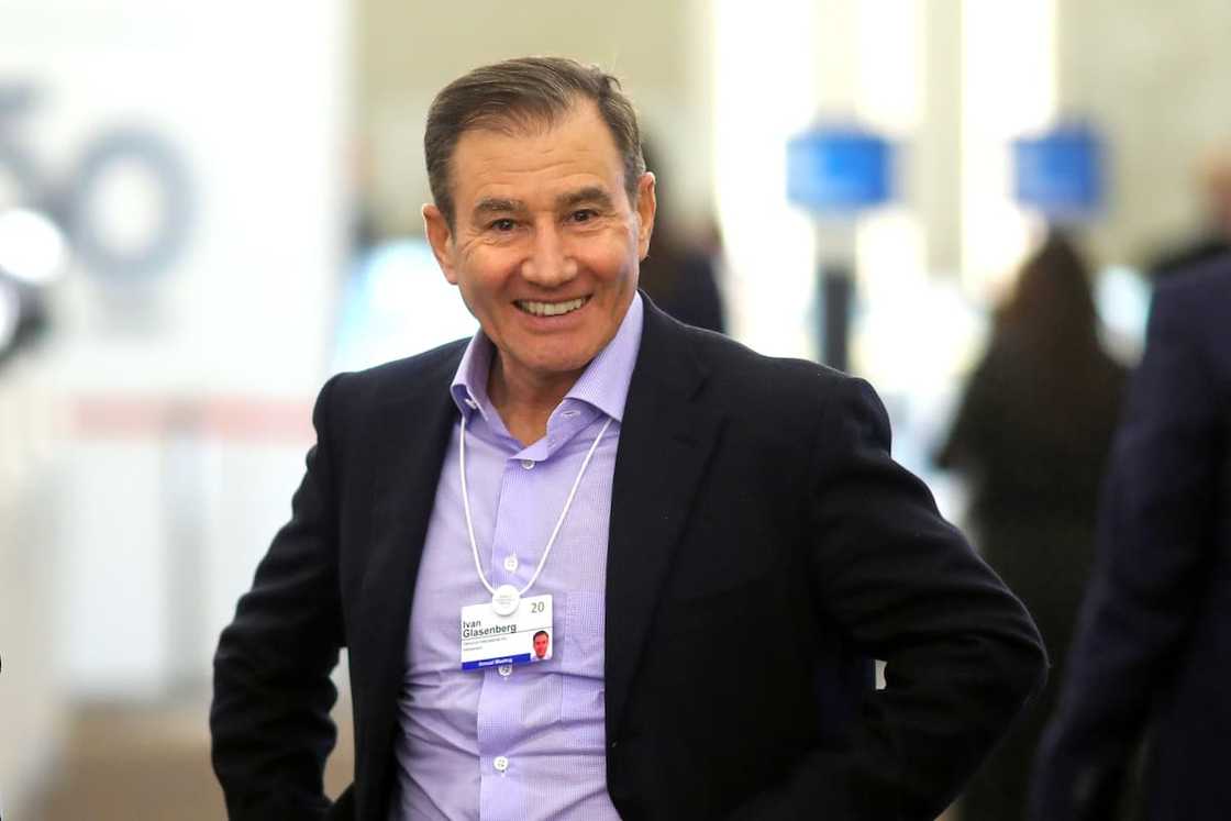 Ivan Glasenberg in a black suit and purple shirt smilling Ivan Glasenberg in a black suit and purple shirt smilling