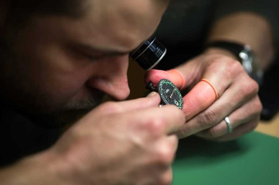 ID Geneve brand co-founder Cedric Mulhauser works on a watch movement