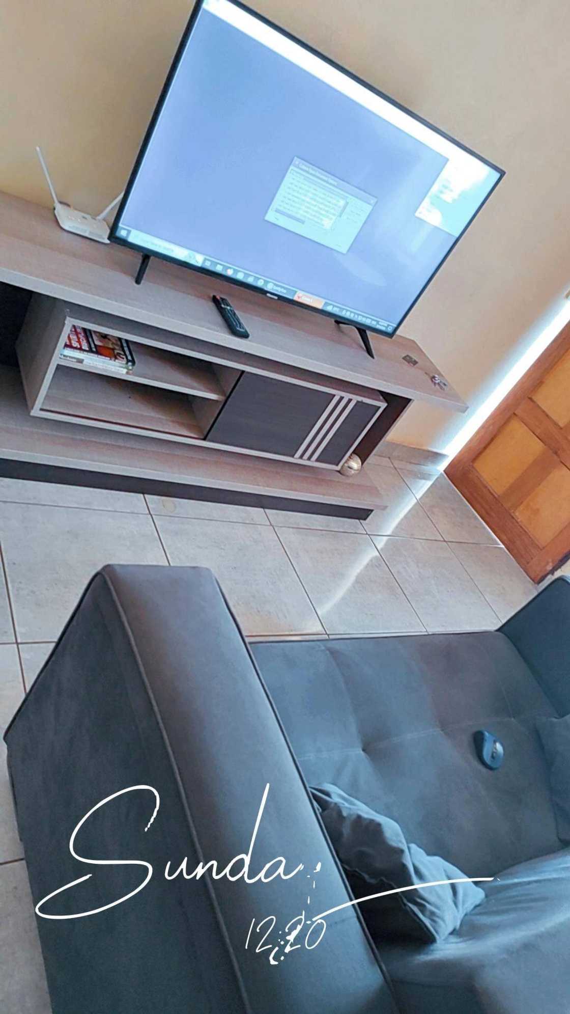 The lounge has a couch and a television. The lounge has a couch and a television.