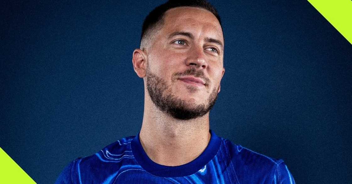 Eden Hazard models Chelsea's new home kit.