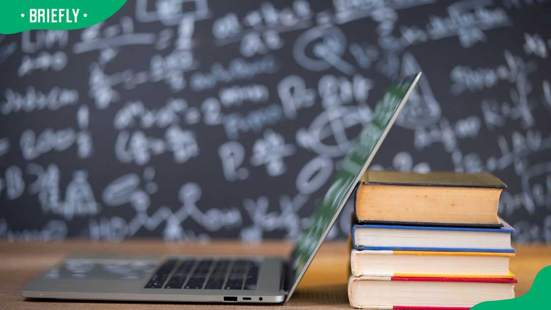 A laptop and books