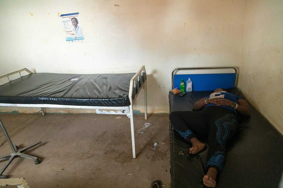 A patient believed to have Ebola rests at a health centre waiting late last month to be transferred to an isolation unit in Mubende, Uganda. A patient believed to have Ebola rests at a health centre waiting late last month to be transferred to an isolation unit in Mubende, Uganda.