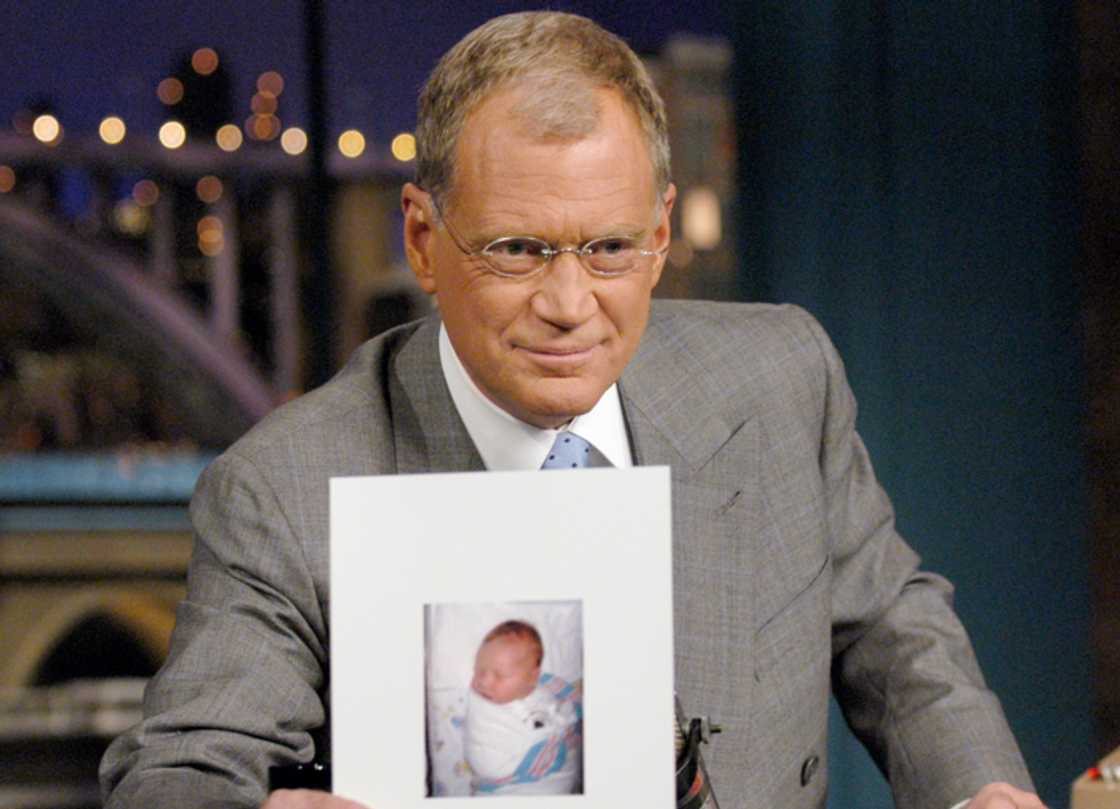 David Letterman holds a photo of his new son, Harry Joseph Letterman on the CBS Television Network