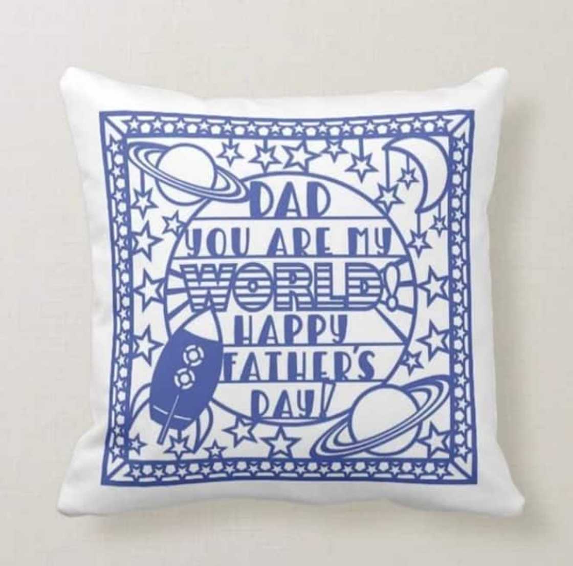 A with pillow with blue pattern with the words "Dad, you are my world! Happy Father's Day!" A with pillow with blue pattern with the words "Dad, you are my world! Happy Father's Day!"