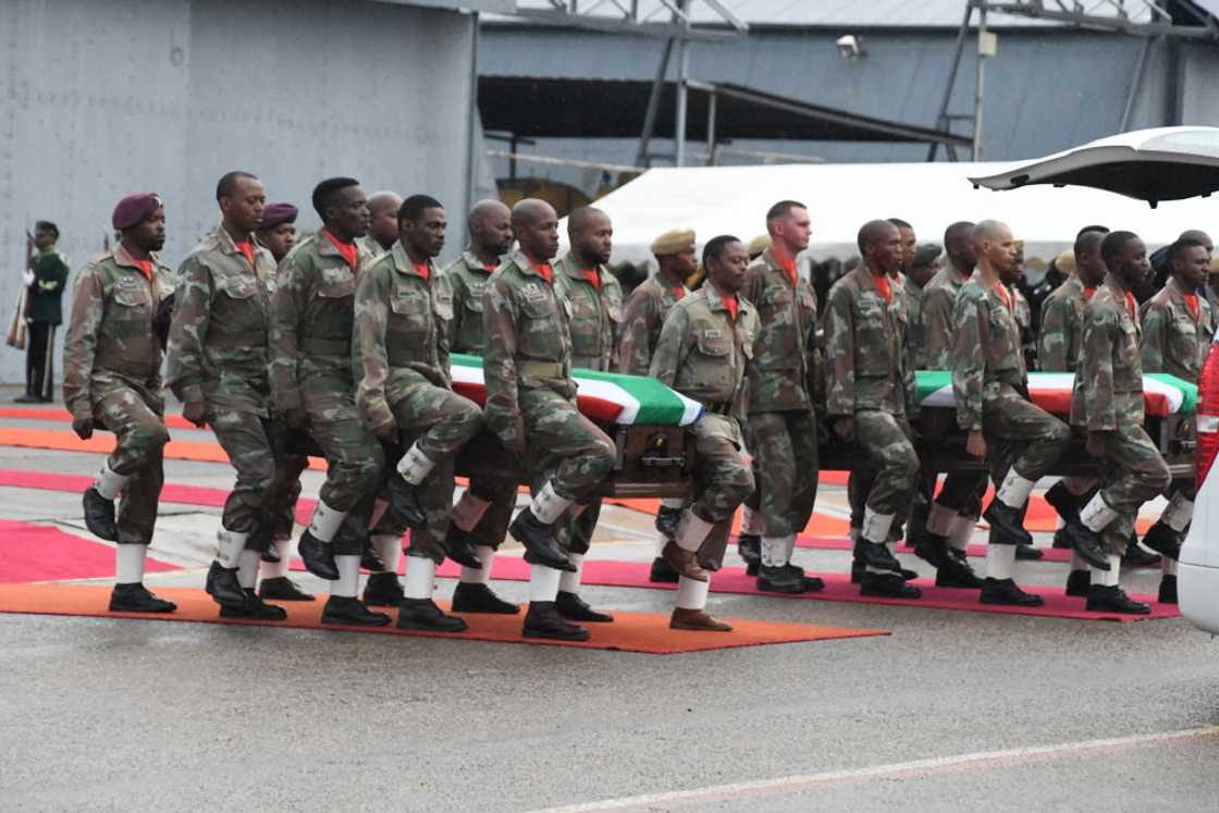 SANDF members carried their comrades' remains SANDF members carried their comrades' remains