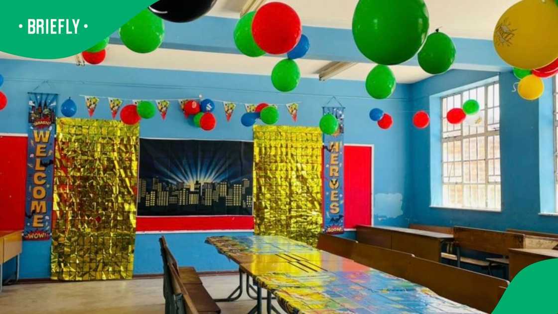 Lisa and her mother put up superhero-themed decorations for the party.