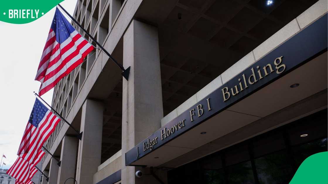 Flags hang outside of the J. Edgar Hoover Federal Bureau of Investigation (FBI) building