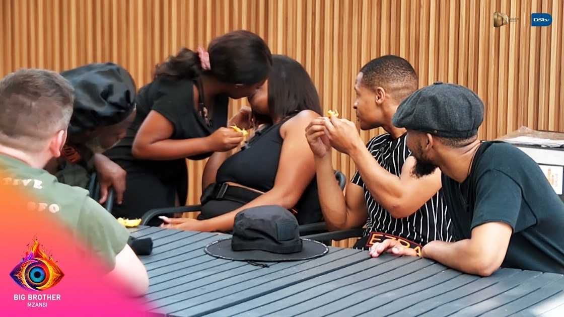 Nate kissing Joho in 'Big Brother Mzansi;. Nate kissing Joho in 'Big Brother Mzansi;.
