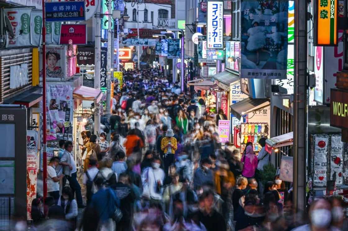 People walking down Takeshita Street in the Harajuku area of Tokyo, a popular shopping district