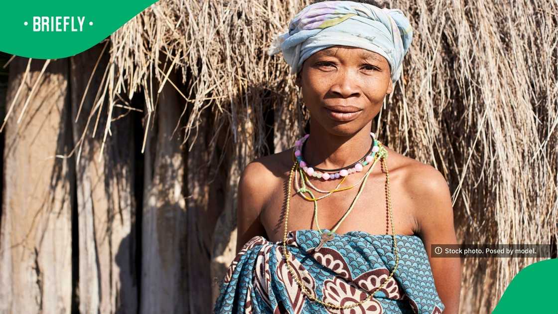 A Khoisan tribe woman beamed with pride as she stood facing the camera for a portrait. A Khoisan tribe woman beamed with pride as she stood facing the camera for a portrait.