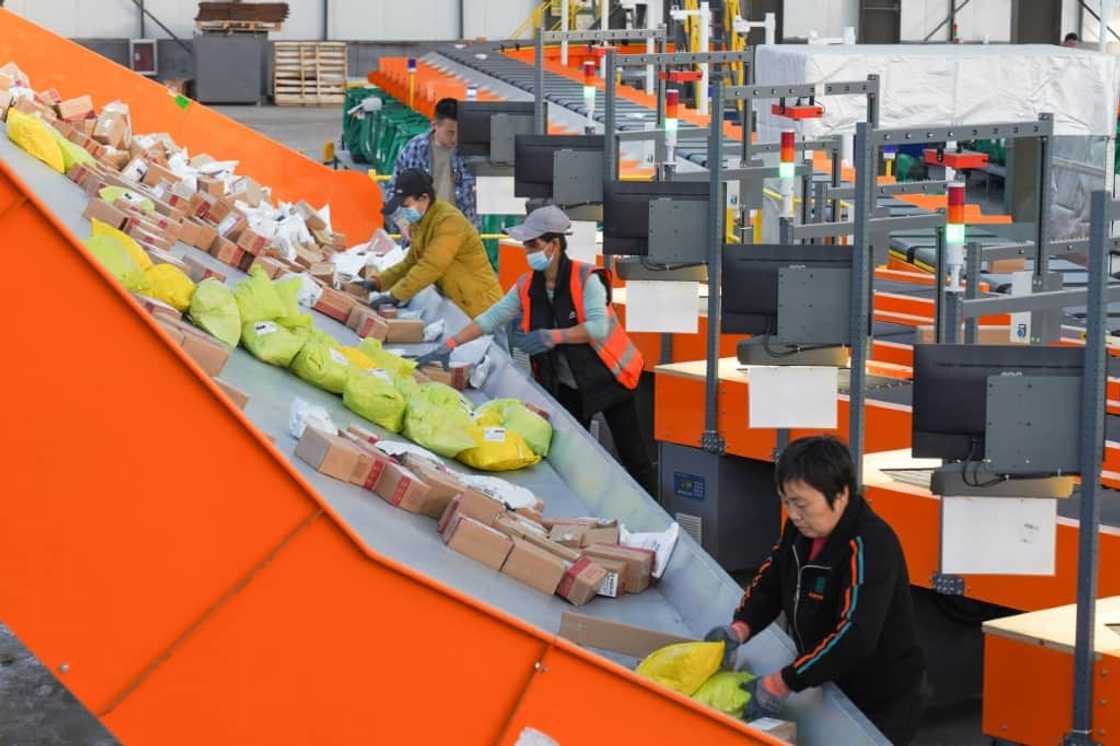 Workers sort packages for delivery ahead of the Singles' Day sales bonanza in China