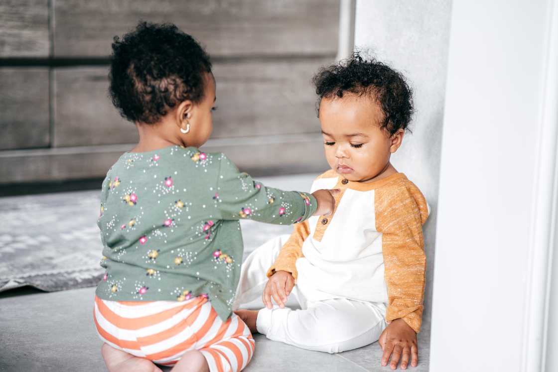 Twins playing together Twins playing together