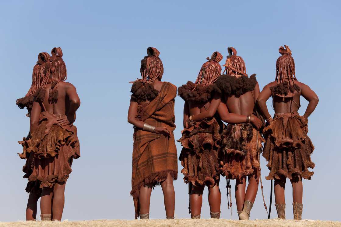 Himba tribe apply red clay all over their bodies Himba tribe apply red clay all over their bodies