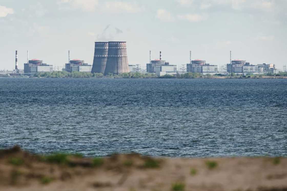 In this file photo taken on April 27, 2022 a general view shows the Zaporizhzhia nuclear power plant, situated in the Russian-controlled area of Enerhodar, seen from Nikopol