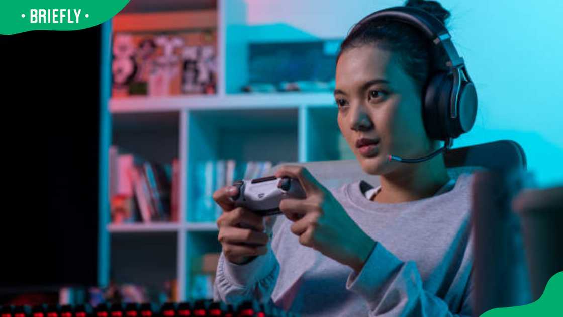 A young lady playing PS