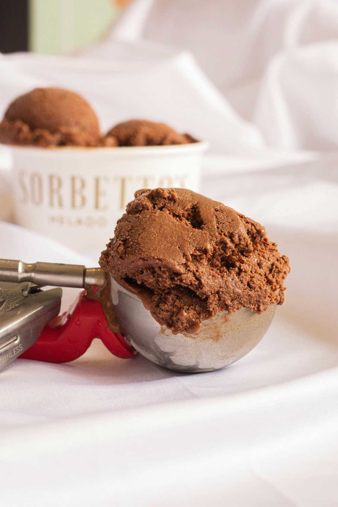 Family annoyed by man taking big scoops of ice cream