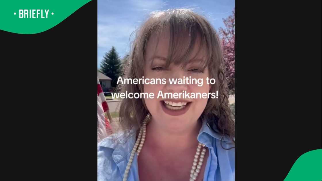 An American woman welcomed the 49 Afrikaners leaving to the US. An American woman welcomed the 49 Afrikaners leaving to the US.