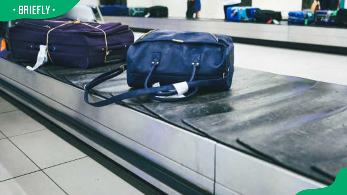 luggage on a conveyer belt at an airport