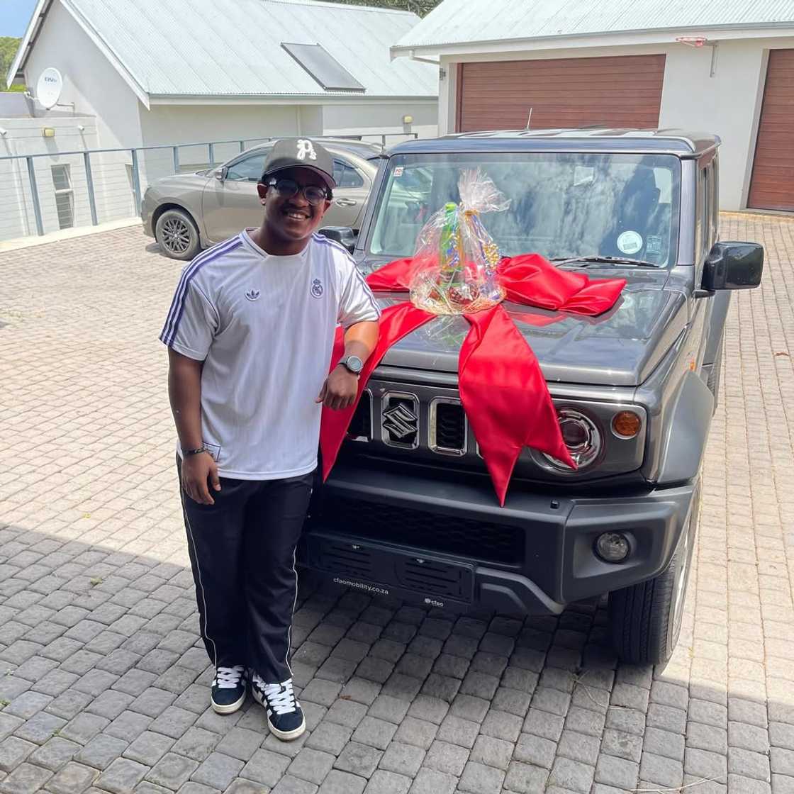Liyema with his new car. Liyema with his new car.