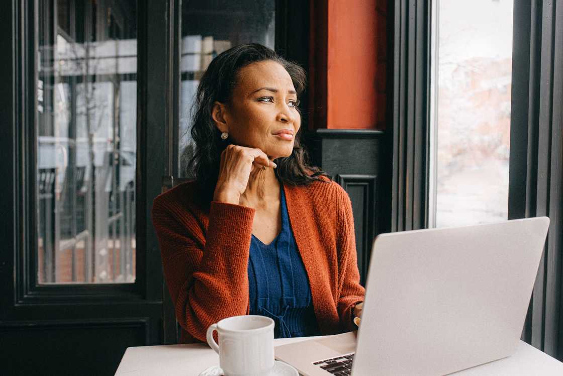 a senior woman using a laptop a senior woman using a laptop