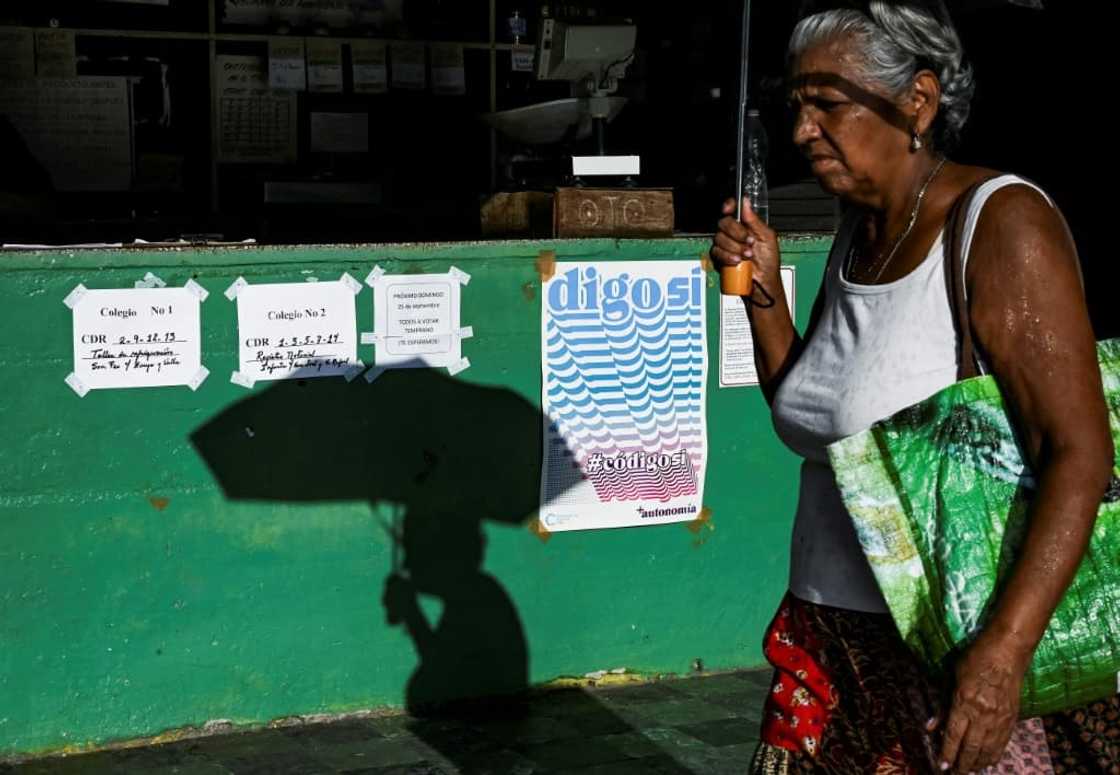 A woman walks past a sign in favor of the new family code in Havana ahead of Sunday's referendum A woman walks past a sign in favor of the new family code in Havana ahead of Sunday's referendum