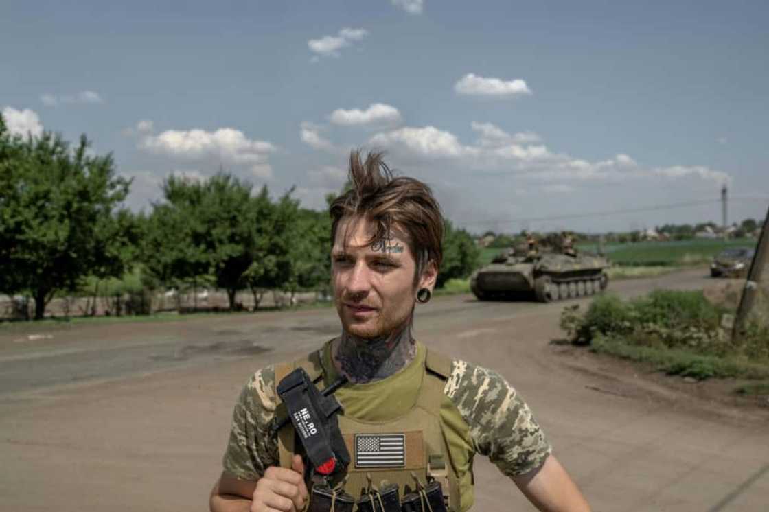 The word 'Freedom' is etched in cursive tattoo ink on Ukrainian soldier Mykhailo's forehead The word 'Freedom' is etched in cursive tattoo ink on Ukrainian soldier Mykhailo's forehead