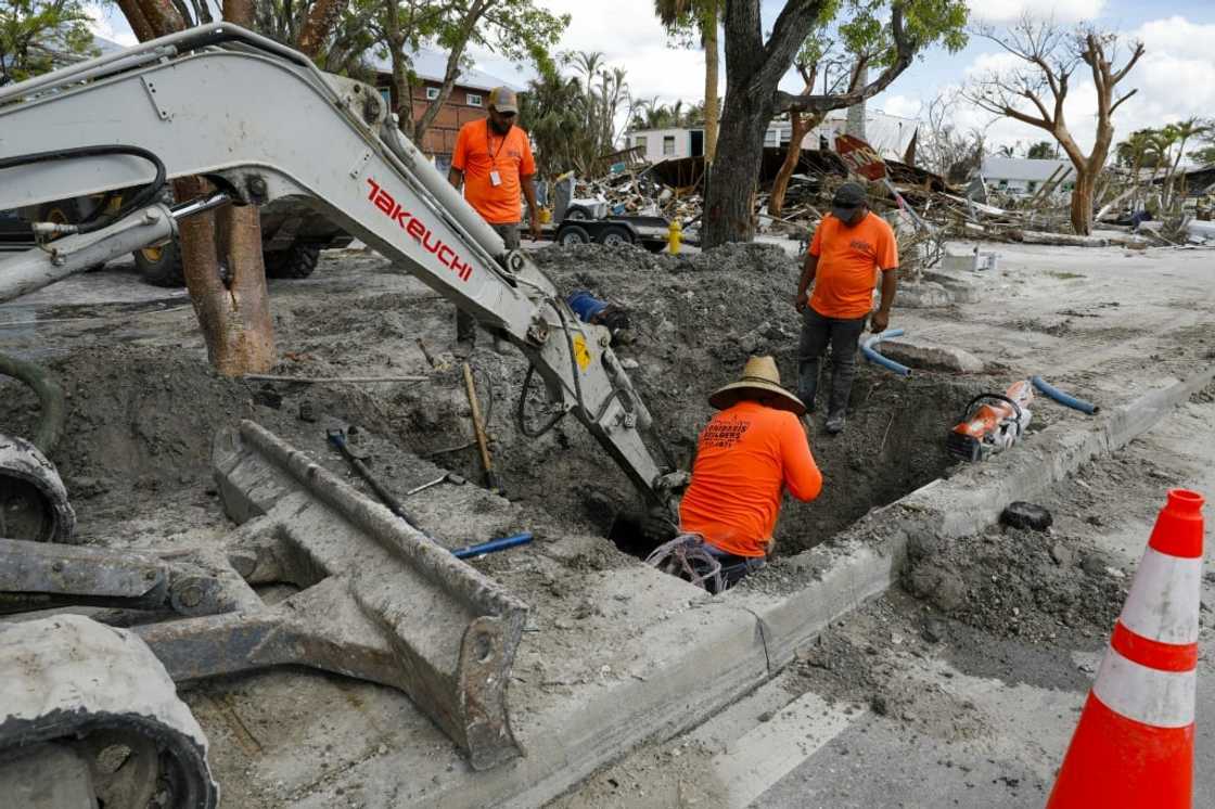 Construction workers toil to restore services on Fort Myers Beach, Florida, on November 2, 2022 Construction workers toil to restore services on Fort Myers Beach, Florida, on November 2, 2022