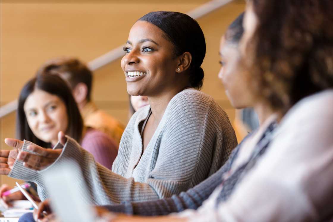 A lady in campus answering questions A lady in campus answering questions
