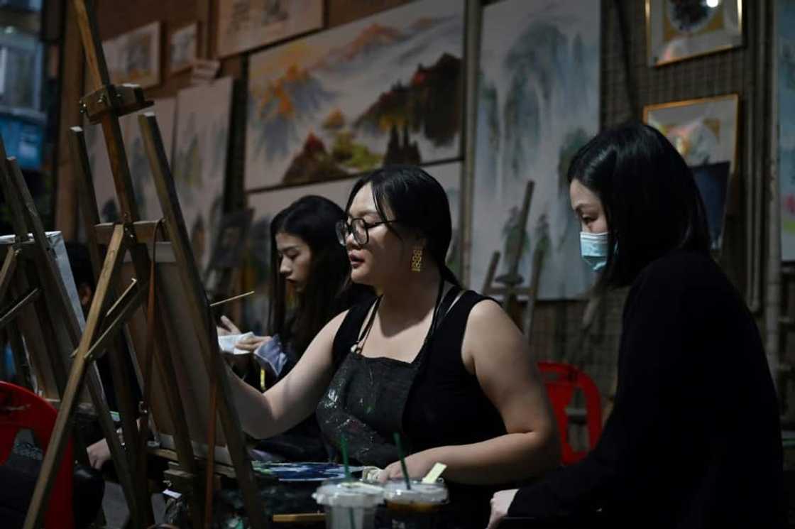 Since China's dismantling of its zero-Covid policy in late 2022, the streets of Dafen are once again bustling with visitors Since China's dismantling of its zero-Covid policy in late 2022, the streets of Dafen are once again bustling with visitors
