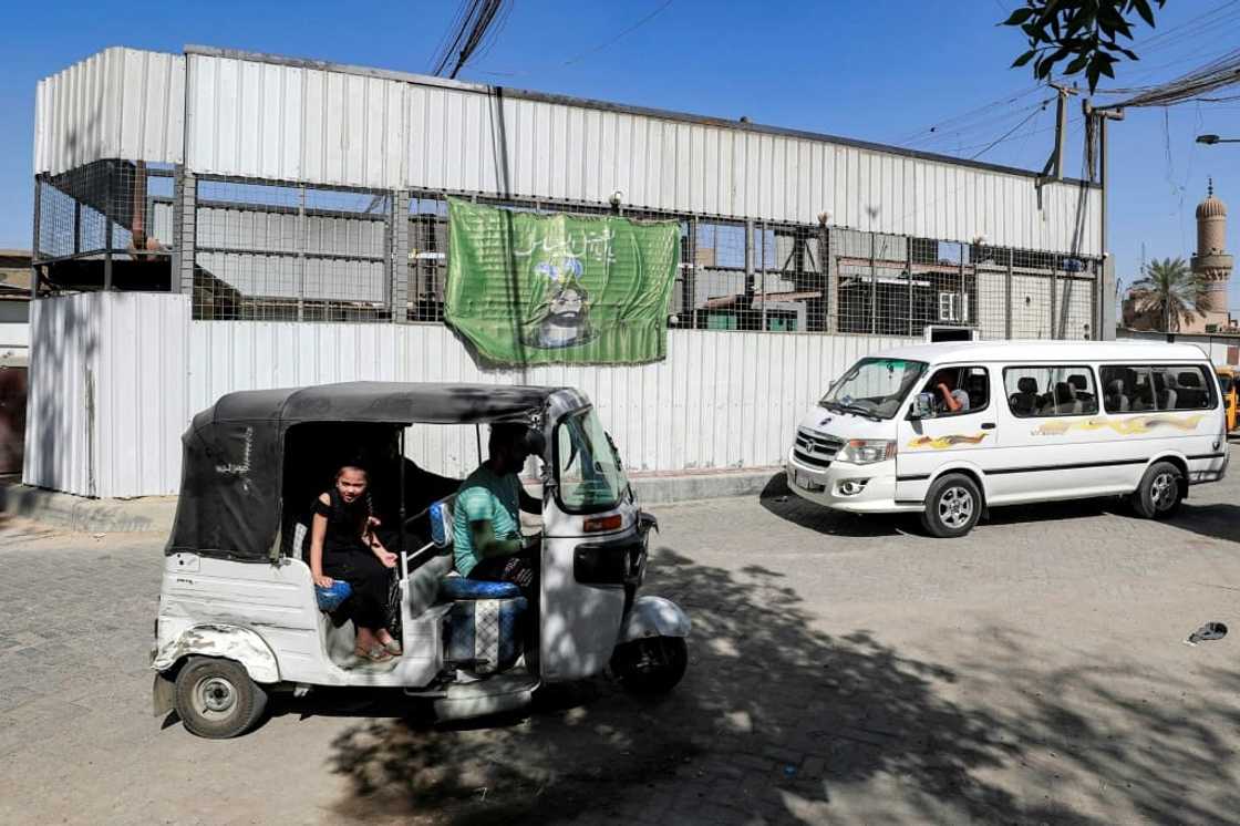 A building housing electricity generators is seen in Sadr City, Baghdad. Iraq has some hydro-electric power but no nuclear plants, and is just beginning to explore renewable energy options such as solar panels