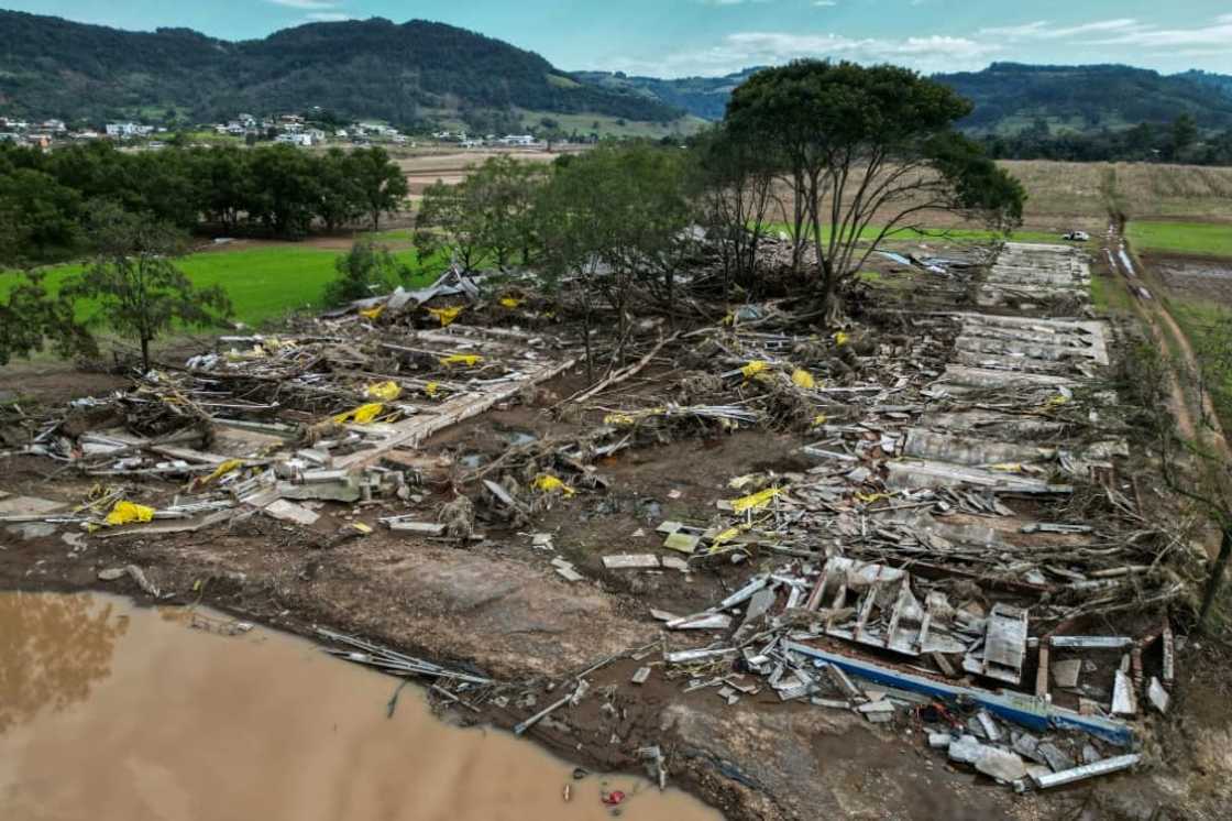 Aerial view of a pig farm destroyed in the flooding, which washed away some 5,000 of the animals here Aerial view of a pig farm destroyed in the flooding, which washed away some 5,000 of the animals here