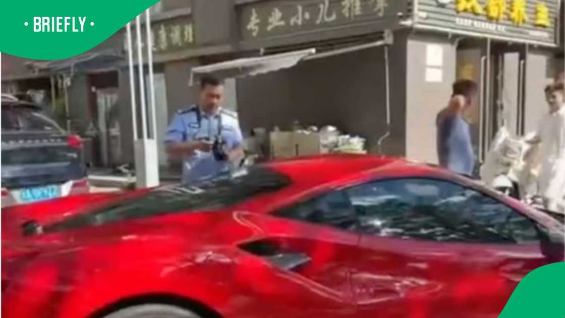 The image captured a law enforcement official examining a luxury sports car following an incident where children vandalised its exterior