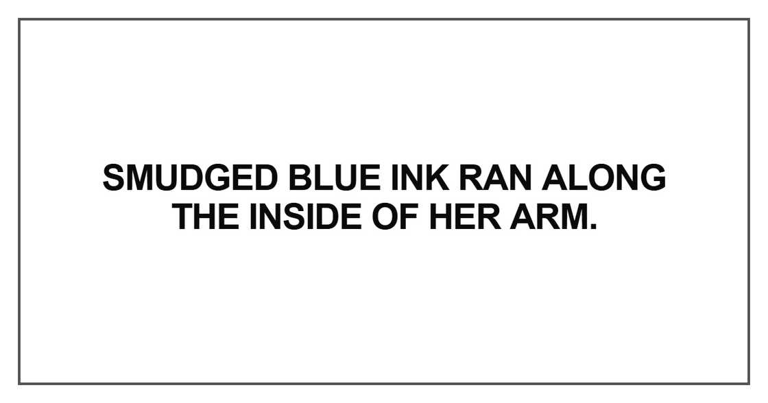 Smudged blue ink ran along the inside of her arm