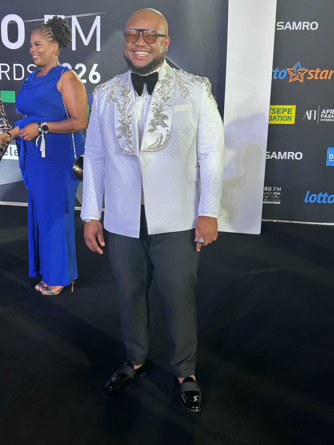 DJ Sabby wore a black and white suit at the Metros.