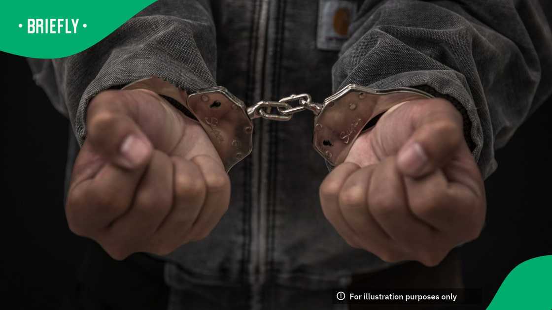 Upset handcuffed man imprisoned for financial crime, punished for serious fraud
