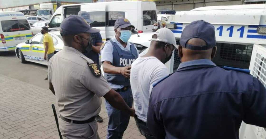 40 taxi operators, Cape Town police station, free driver and boss, arrested