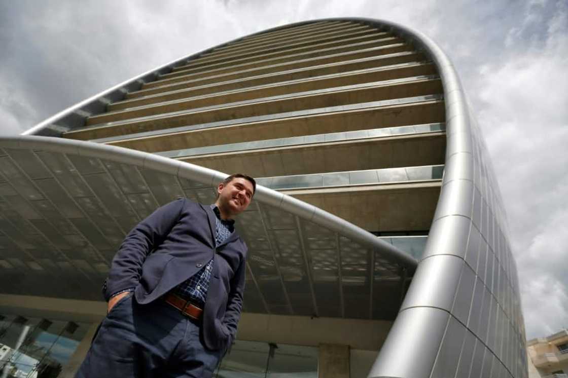 Russian IT specialist Dmitri Leonov poses next to 'The Oval', part of the transformed Limassol skyline Russian IT specialist Dmitri Leonov poses next to 'The Oval', part of the transformed Limassol skyline