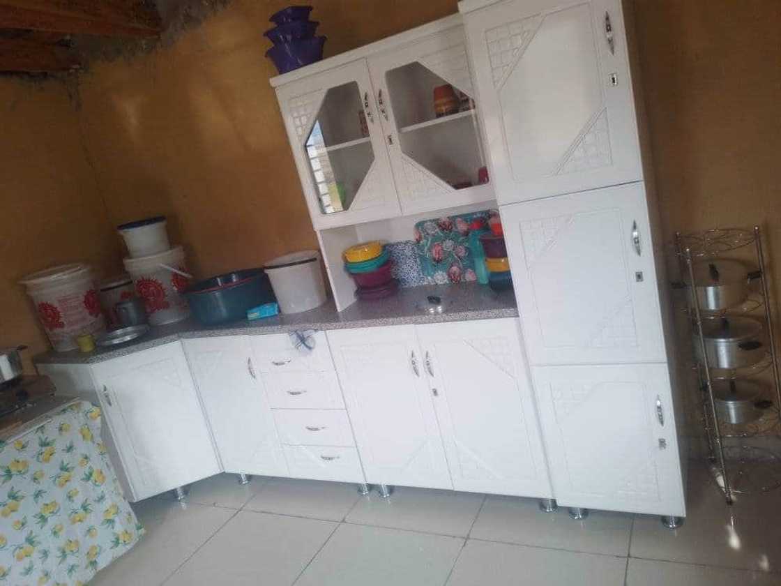 Woman shows off her kitchen. Woman shows off her kitchen.