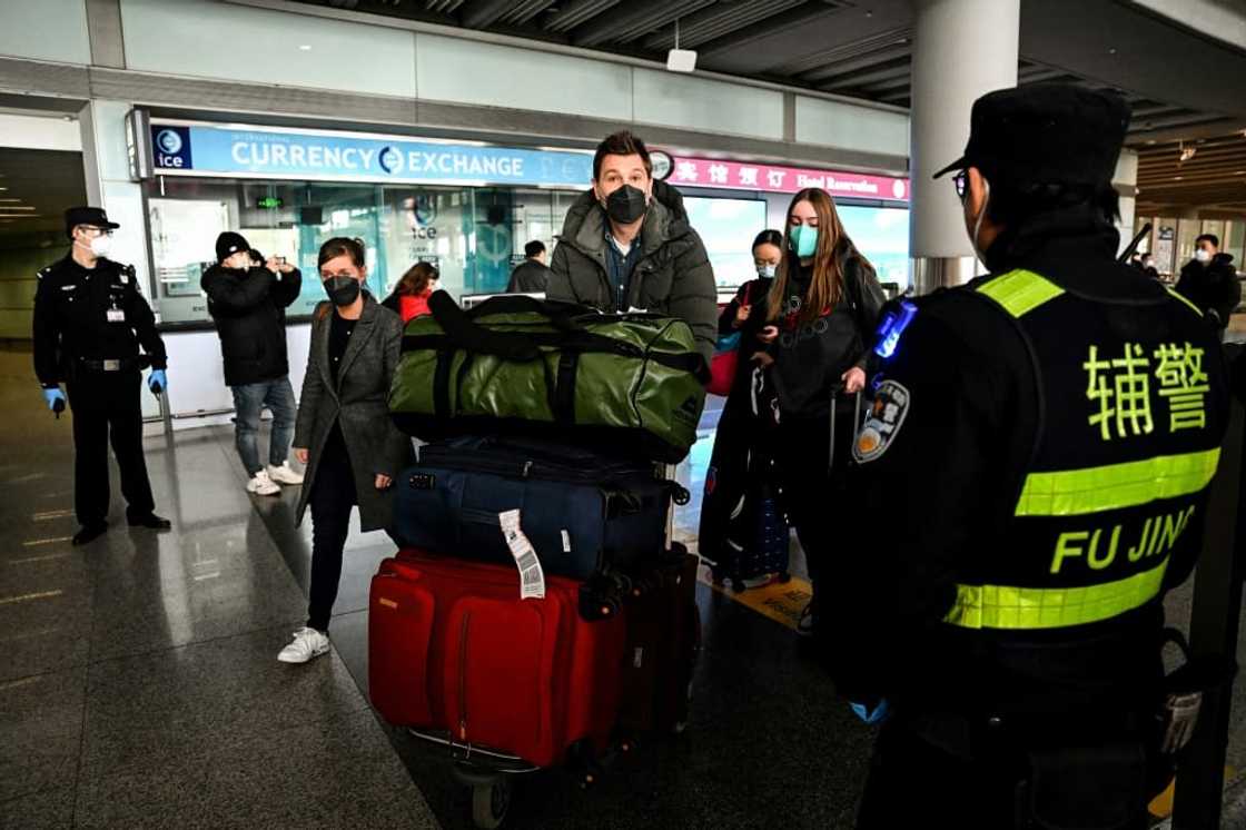 Passengers in the arrivals area at the Capital International Airport in Beijing on January 8, 2023 Passengers in the arrivals area at the Capital International Airport in Beijing on January 8, 2023