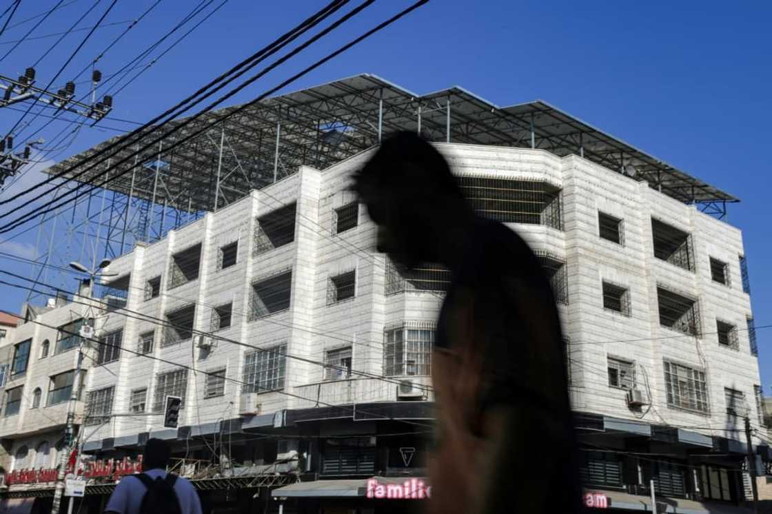 For most of Gaza's 2.3 million residents, power cuts are a daily occurrence, and many are turning to solar power, such as these panels on the roof of a bakery