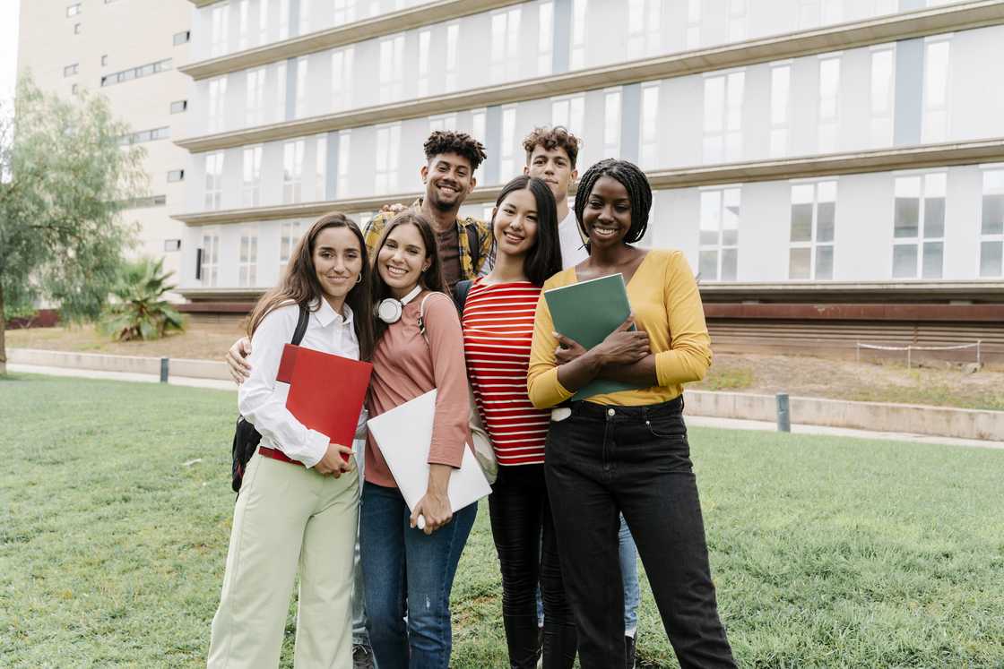 Group portrait of college students outside the University