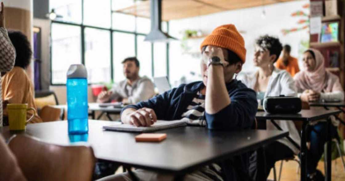 A stressed student in class. A stressed student in class.