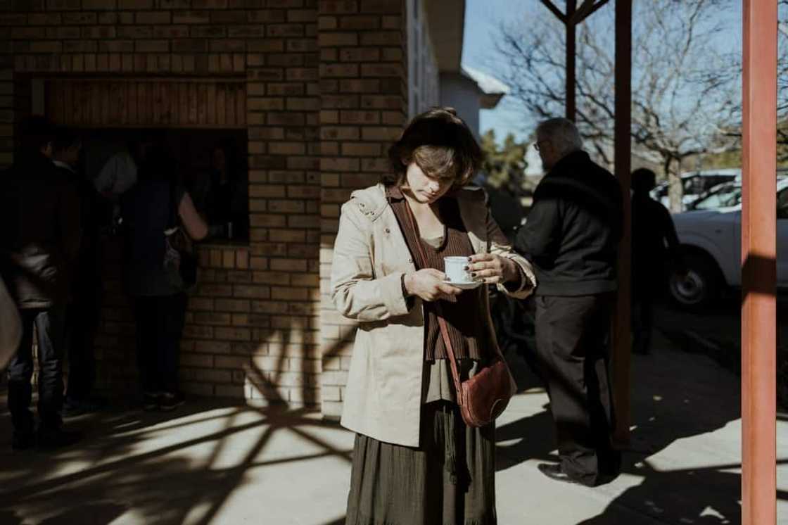 Sunday service: A worshipper enjoys tea at Orania's Dutch Reformed Church