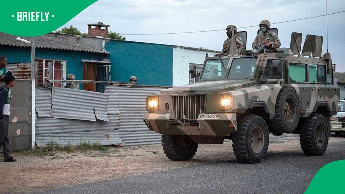 South African National Defence Force (SANDF) soldiers stand on an armoured vehicle during a stop-and-search patrol as part of Operation Prosper in Retreat, near Cape Town, on April 10, 2026 South African National Defence Force (SANDF) soldiers stand on an armoured vehicle during a stop-and-search patrol as part of Operation Prosper in Retreat, near Cape Town, on April 10, 2026